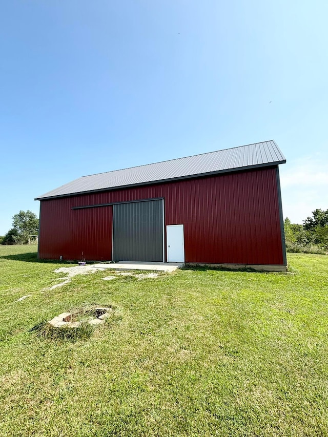 view of outdoor structure with a lawn