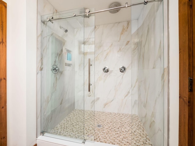 bathroom featuring an enclosed shower