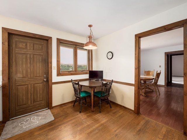 dining area featuring wood-type flooring