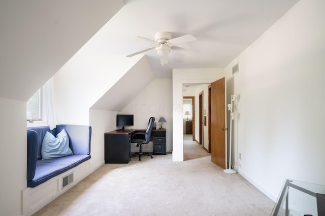 office space featuring light carpet, ceiling fan, and lofted ceiling