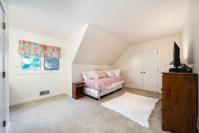 bedroom with light carpet and vaulted ceiling