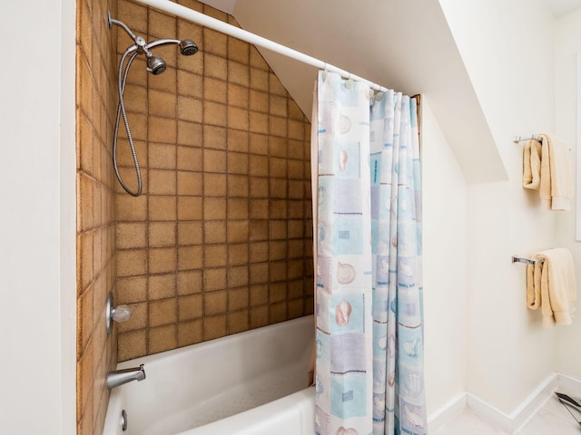 bathroom featuring tile patterned flooring and shower / bathtub combination with curtain