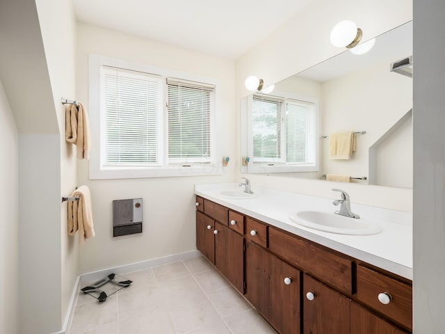 bathroom featuring tile patterned flooring and vanity