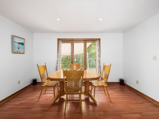 dining space featuring hardwood / wood-style floors