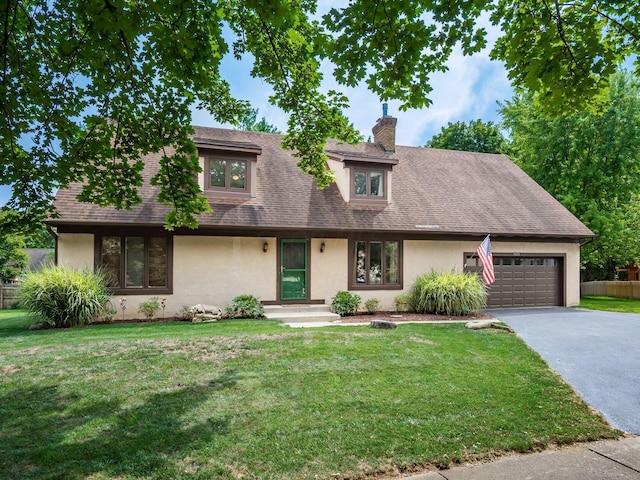 view of front facade featuring a front yard and a garage