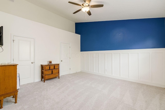 interior space featuring ceiling fan and vaulted ceiling