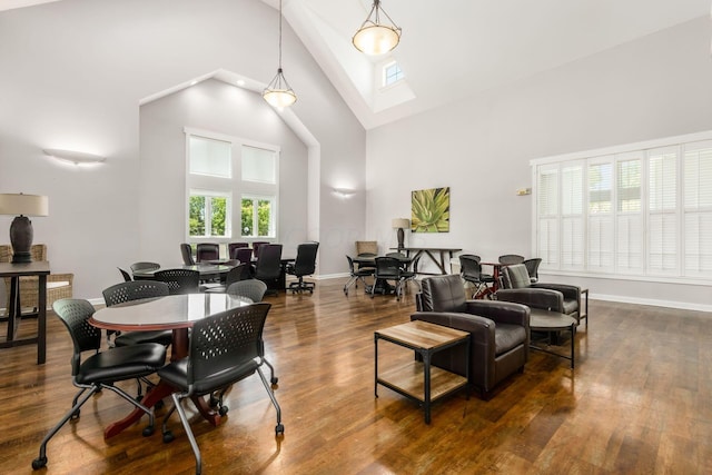 living room featuring dark hardwood / wood-style flooring and high vaulted ceiling