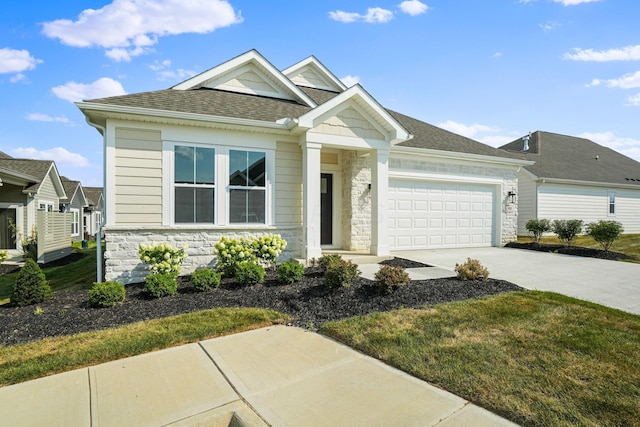 view of front of home featuring a garage and a front lawn