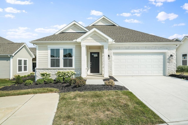 view of front of house with a garage and a front lawn