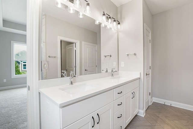 bathroom featuring vanity and parquet floors