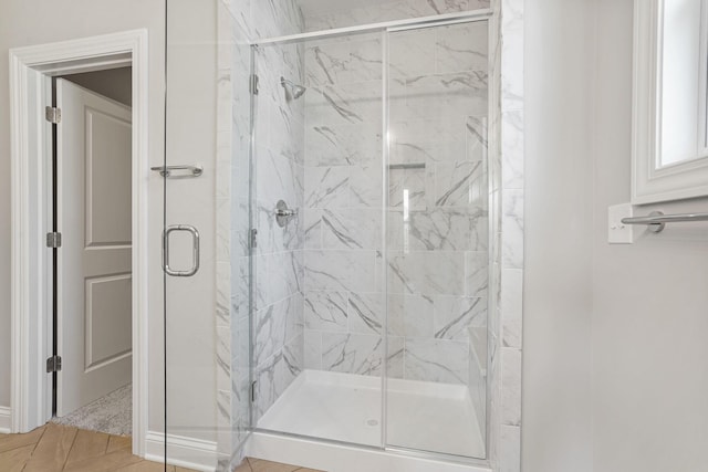 bathroom with tile patterned floors and walk in shower