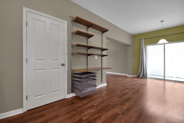 unfurnished living room featuring dark hardwood / wood-style floors