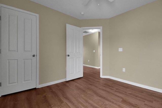 unfurnished bedroom with hardwood / wood-style flooring and ceiling fan