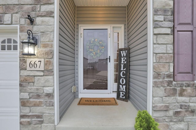 667 Green Forest Pl, Lithopolis, OH 43136 - property entrance featuring stone siding