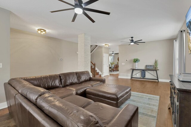 667 Green Forest Pl, Lithopolis, OH 43136 - living room featuring a ceiling fan, stairway, wood finished floors, and baseboards