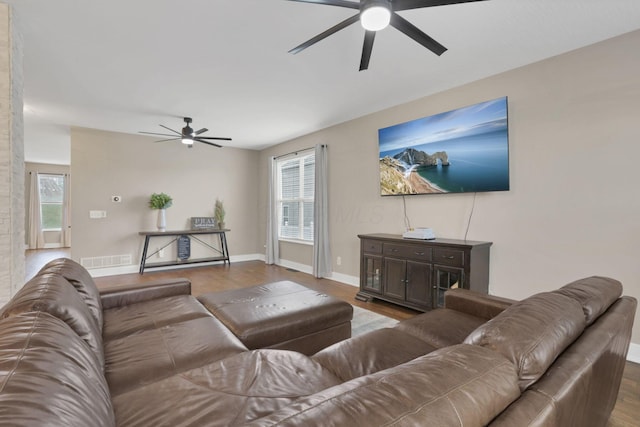 667 Green Forest Pl, Lithopolis, OH 43136 - living area featuring a ceiling fan, wood finished floors, plenty of natural light, and baseboards