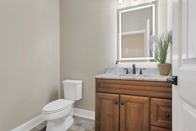 667 Green Forest Pl, Lithopolis, OH 43136 - bathroom with baseboards, toilet, and vanity