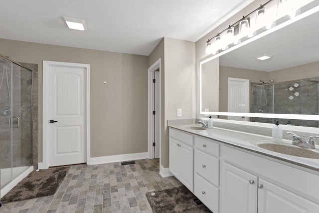 667 Green Forest Pl, Lithopolis, OH 43136 - bathroom with double vanity, a stall shower, and baseboards