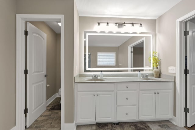 667 Green Forest Pl, Lithopolis, OH 43136 - full bath featuring double vanity, toilet, and baseboards