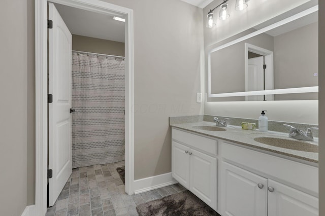667 Green Forest Pl, Lithopolis, OH 43136 - bathroom featuring double vanity, baseboards, and curtained shower