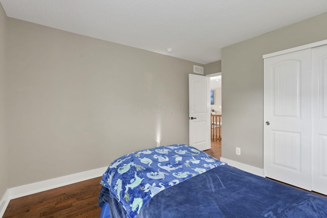 667 Green Forest Pl, Lithopolis, OH 43136 - bedroom with baseboards, wood finished floors, and a closet