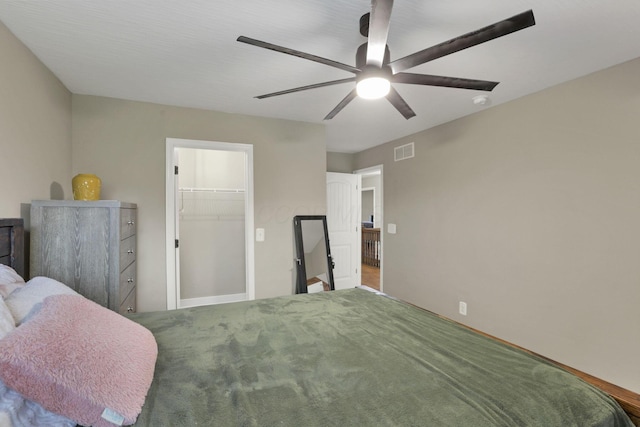 667 Green Forest Pl, Lithopolis, OH 43136 - bedroom with a walk in closet, a ceiling fan, and a closet