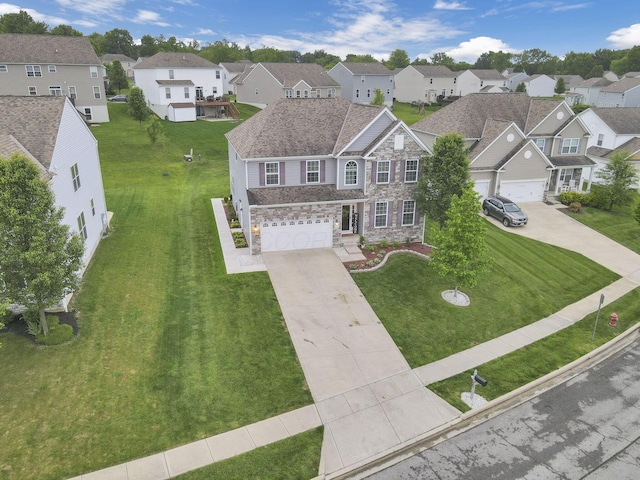 667 Green Forest Pl, Lithopolis, OH 43136 - view of front of house featuring a residential view, driveway, a garage, and a front yard