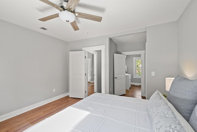 bedroom featuring hardwood / wood-style flooring and ceiling fan