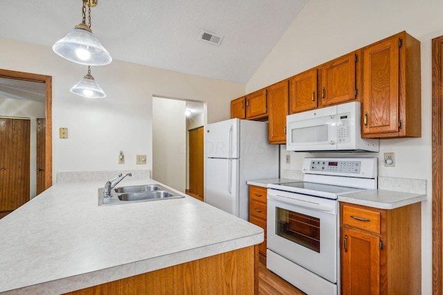 kitchen featuring sink, lofted ceiling, decorative light fixtures, white appliances, and light wood-type flooring