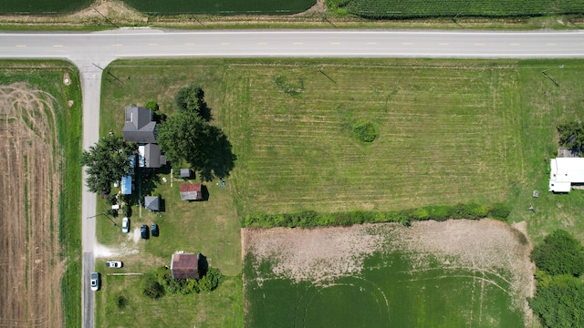 birds eye view of property with a rural view