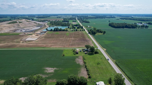 bird's eye view with a water view and a rural view