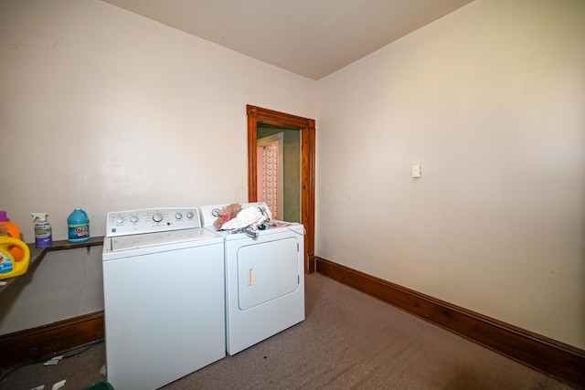 laundry area with dark colored carpet and separate washer and dryer