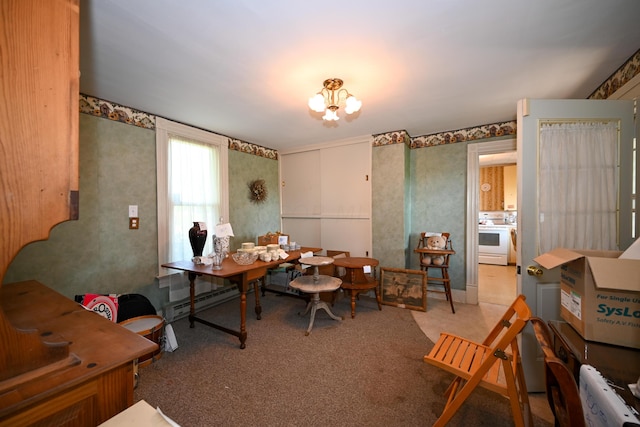 office with light carpet and an inviting chandelier