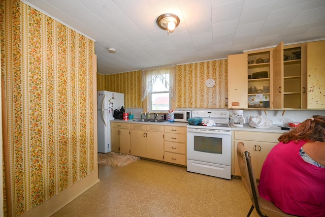 kitchen featuring sink and white appliances