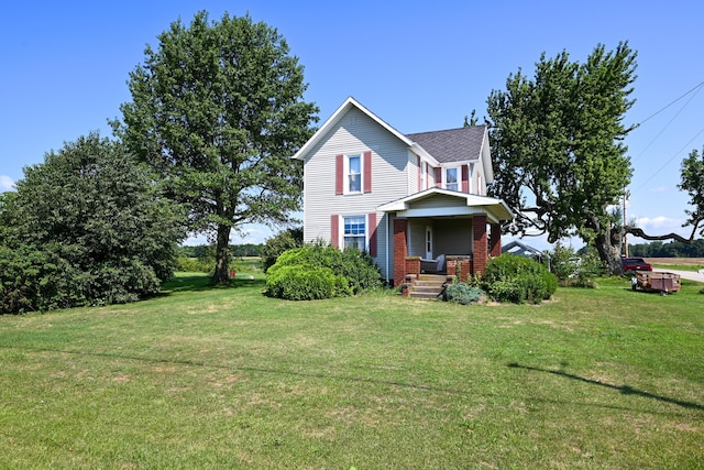 view of front of home featuring a porch and a front lawn