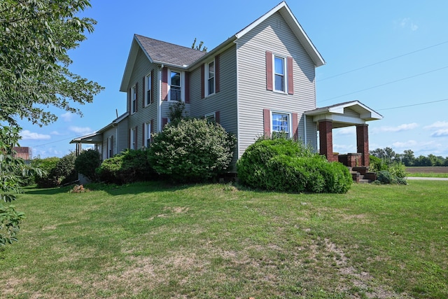 view of home's exterior featuring a yard