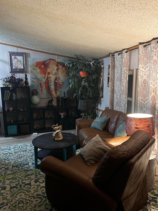 living room with carpet, a textured ceiling, and ornamental molding