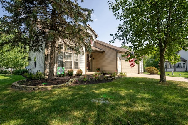 view of front of home featuring a front lawn and a garage