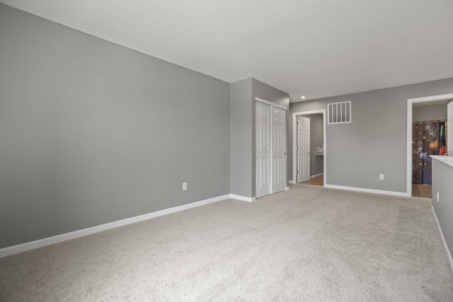 empty room with carpet flooring