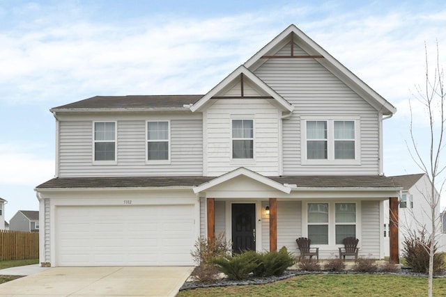 view of front facade featuring a garage and a front yard