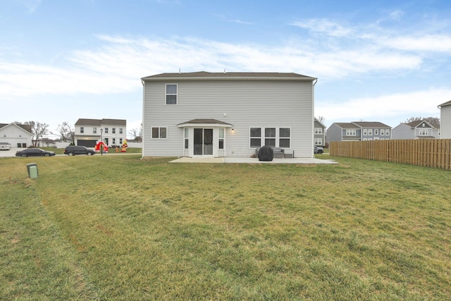 rear view of property with a patio area and a yard