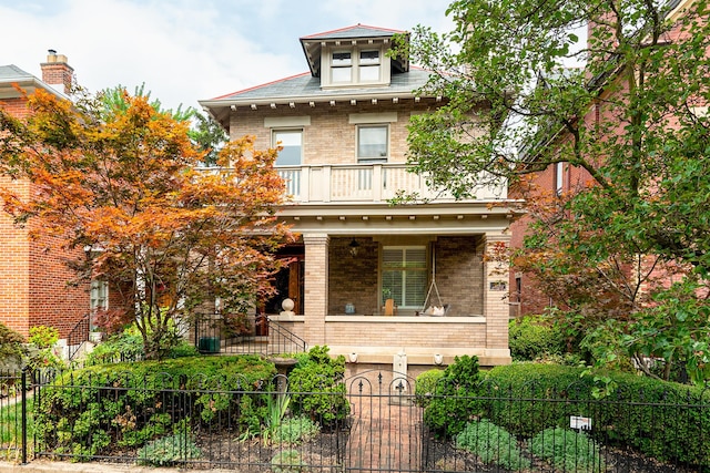 view of front of home with a balcony