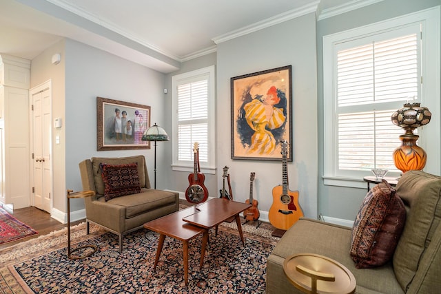 living room with crown molding and hardwood / wood-style floors