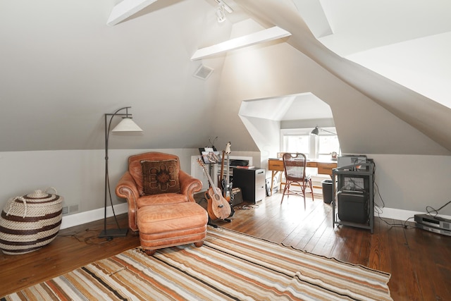 living area with hardwood / wood-style flooring, rail lighting, and lofted ceiling