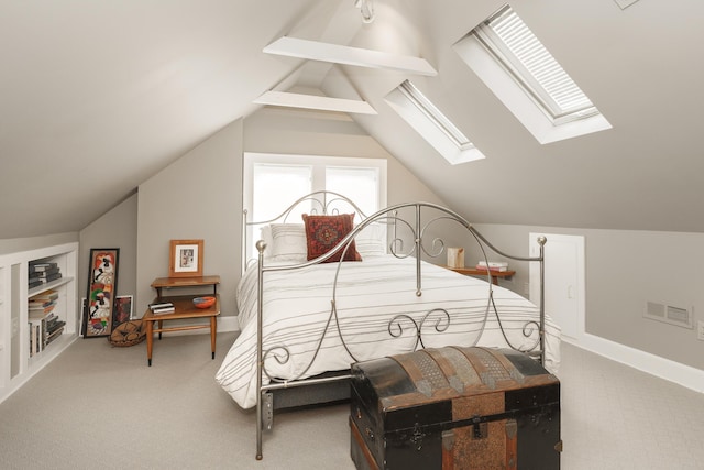 carpeted bedroom with vaulted ceiling