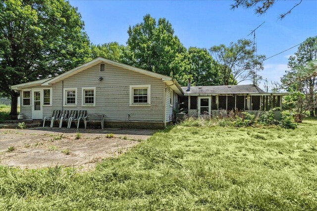 7888 Mingo Lewisburg Rd, North Lewisburg, OH 43060 - rear view of property featuring a sunroom