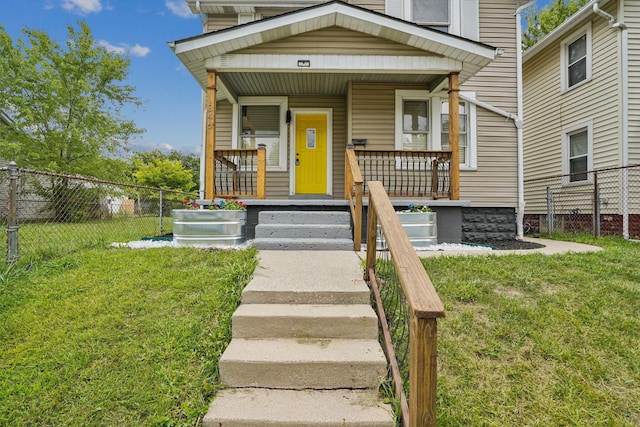 exterior space with a porch and a front yard