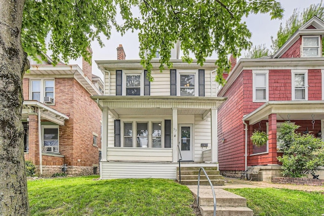 53 N Warren Ave, Columbus, OH 43204 - traditional style home with a chimney, covered porch, a front yard, and cooling unit