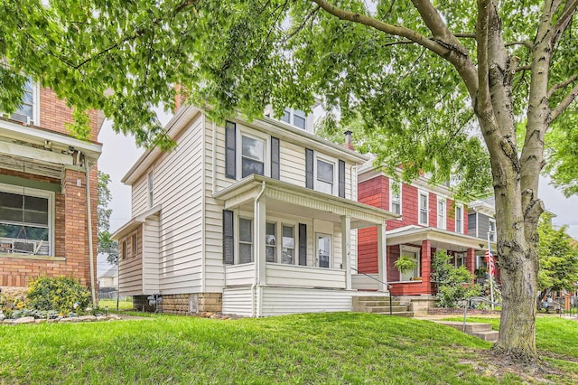 53 N Warren Ave, Columbus, OH 43204 - american foursquare style home featuring a front lawn