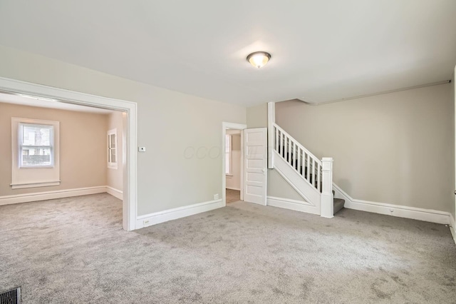 53 N Warren Ave, Columbus, OH 43204 - carpeted spare room featuring baseboards and stairway